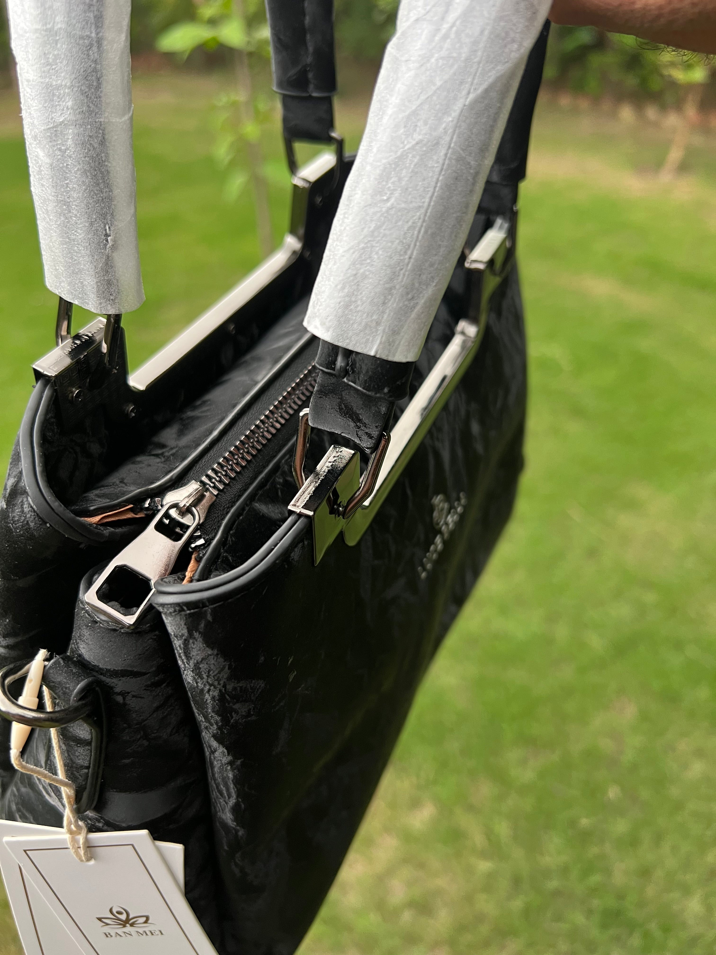 Elegant Black Handbag with Metal Top Handle & Shoulder Strap
