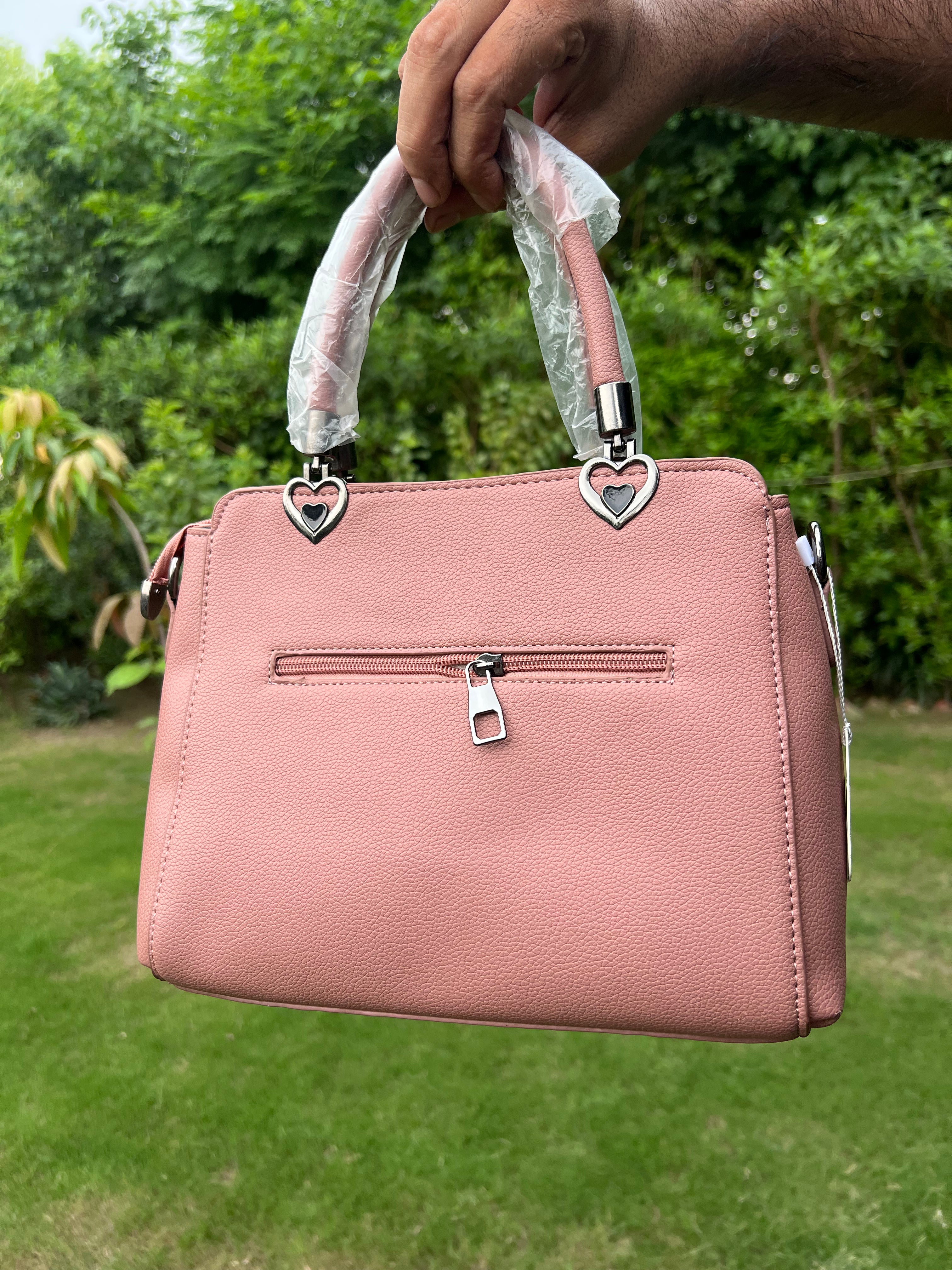 Elegant Pink Bow Handbag with Heart Handle Accents