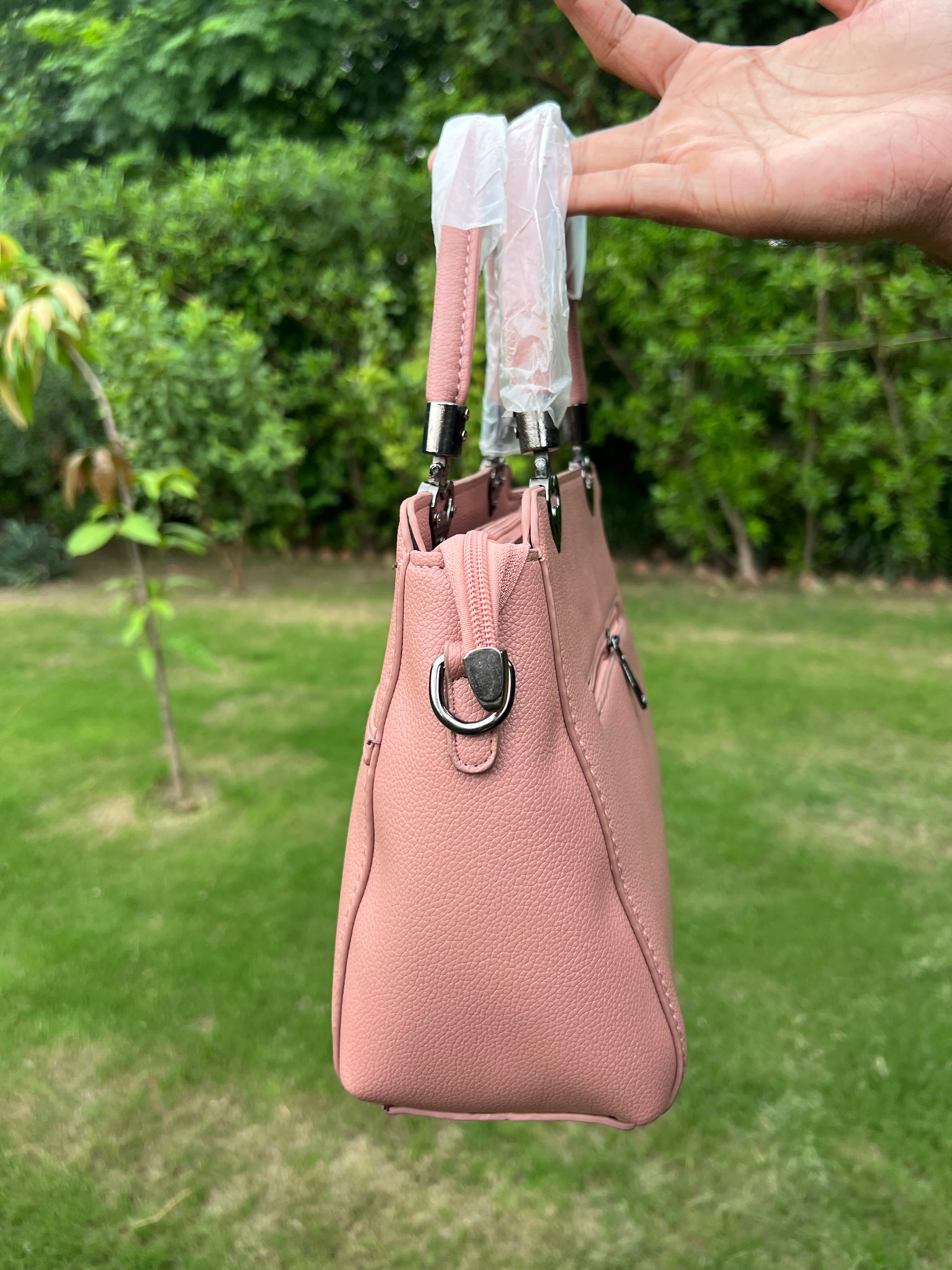 Elegant Pink Bow Handbag with Heart Handle Accents